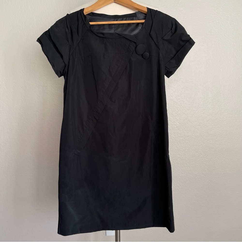 Size XS Black Trench Coat-Like Fabric Dress   In excellent Pre-owned condition.